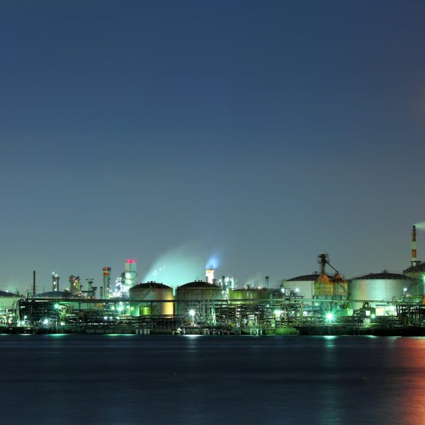 Industrial building and sea at night